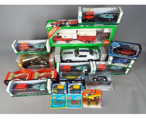 Cararama, Welly, Solido, Siku, Corgi, and Others - 19 boxed diecast and plastic vehicles in various scales. Lot includes Siku