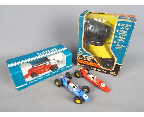 Scalextric - A small collection of vintage Scalextric cars and accessories. Lot includes a boxed Scalextric C023 Scaletti - A
