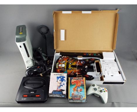 Xbox 360, Sega, Playstation - A mixed group of gaming equipment. Lot contains a Playstion compatible Guitar Hero Guitar, an X