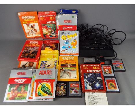 Atari - A vintage unboxed Atari 2600 console, owners manual, Atari Joystick together with approximately 19 games many of whic