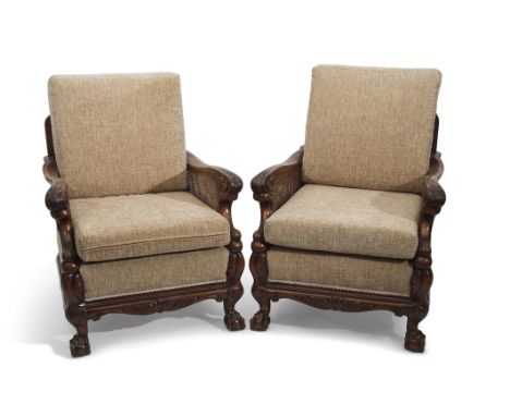 Late 19th/early 20th century mahogany Bergere suite, comprising a double caned three-seater sofa and two matching easy chairs