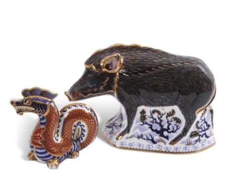 Royal Crown Derby paperweight of The Wild Boar with gold button, together with Royal Crown Derby paperweight of a dragon (but