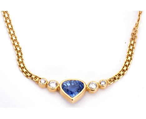Italian tanzanite and diamond necklace centring a heart shaped tanzanite flanked by two graduated round brilliant cut diamond