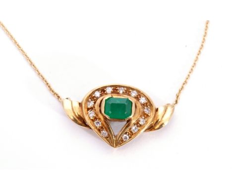 Emerald and diamond pendant necklace of shield shape, centring a step cut emerald, 5 x 3mm, within a small diamond surround, 