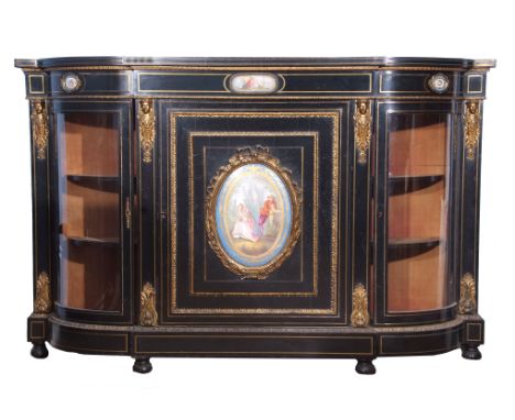 Large Victorian ebonised and ormolu mounted credenza, having a central large fielded panelled door featuring a large hand pai