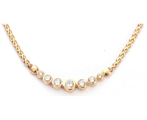Diamond set necklace featuring seven graduated round brilliant cut diamonds, each individually bezel set and joined in a slig