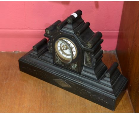 A 19th Century slate mantle clock of Architectural form, the movement striking on a bell