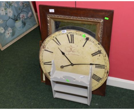 A print, a mirror, a clock and a painted shelf