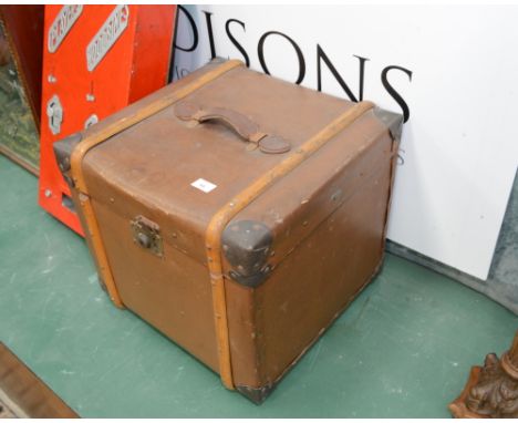 A vintage leather trunk of square form
