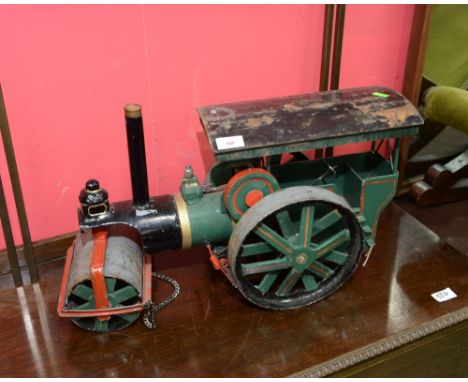 A vintage painted metal steam roller model
