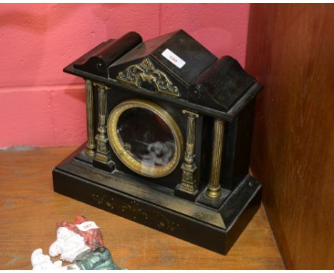 A 19th Century French slate mantle clock case of architectural form, with gilt metal columns, movement lacking.