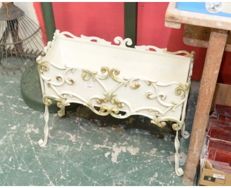 A painted metal planter on stand
