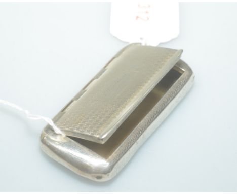 A silver snuff box of shaped rectangular form with engine turned decorated cover,  with central engraved plaque, Chester 1923