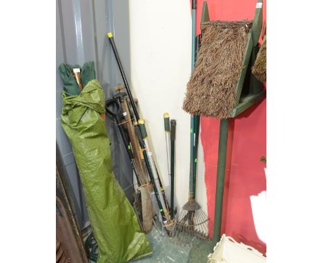A group of garden tools; tog. with a large garden parasol