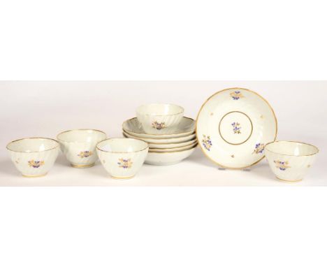 A SET OF FIVE CHAMBERLAIN WORCESTER SHANKED TEA BOWLS AND SIX SAUCERS, ENAMELLED AND GILT WITH A SPRIG PATTERN, SAUCER 14CM D