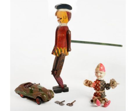 A PAINTED WOOD AND TINPLATE SCOTSMAN PUPPET, 32CM H, A CLOCKWORK CLOWN TOY WITH CELLULOID HEAD AND SCHUCO 4001 CLOCKWORK SPOR