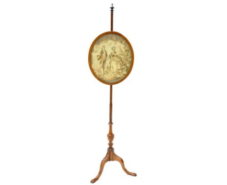 A VICTORIAN MAHOGANY POLE SCREEN WITH CARVED BASE AND EMBROIDERY WORK PANEL