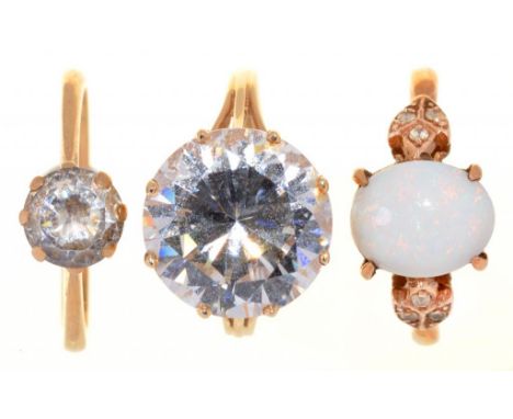 AN IMITATION DIAMOND SOLITAIRE RING, IN 14CT GOLD, LONDON POST 2000, ANOTHER AND AN OPAL RING, BOTH IN 9CT GOLD OR GOLD MARKE