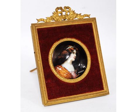 19th century enamel on copper portrait miniature of a young woman, possible Limoges, with foiled detail, 5.5cm diameter (circ