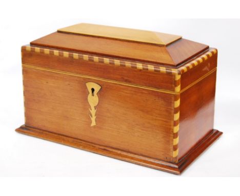 Mahogany and inlaid tea caddy, 27cm wide and 17cm high.