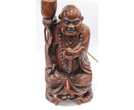 20th century oriental carved hardwood table lamp base in the form of Hotei, with replacement bulb holder, 47.5cm high.Electri