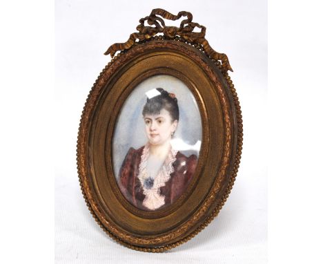 Late 19th/early 20th century miniature portrait of a lady, watercolour on ivory, 10cm x 7cm (oval), in gilt metal frame.