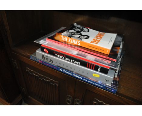 A collection of books to include The Beatles, The Rolling Stones, The Cure etc.