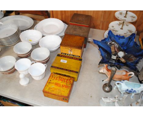 A collection of vintage tins for petrol, lighter fluids and fillers 