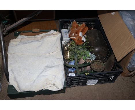 A box containing curtains and a box including an anniversary clock, scales, glass demijohn etc