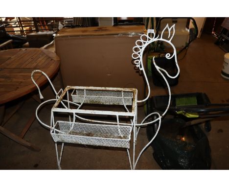 A cast iron wirework planter in the form of a horse