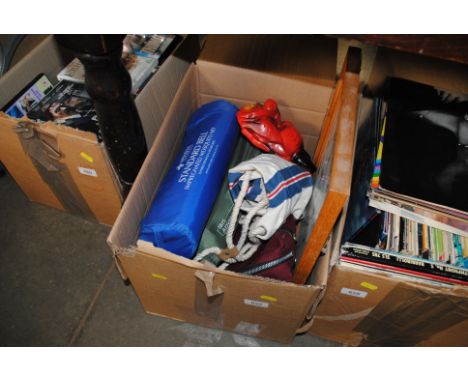 A box containing an advertising print, camping equipment etc. 