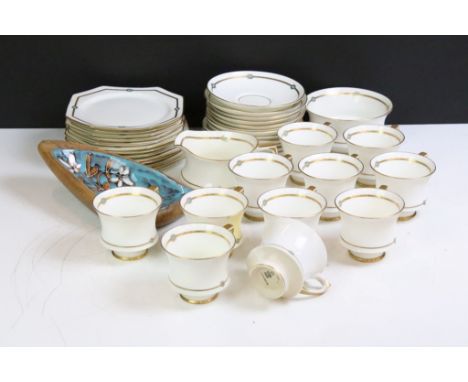 Paragon gilt &amp; white tea service, pattern no. 7153, to include 11 cups, 12 saucers, 12 tea plates, milk jug and sugar bow