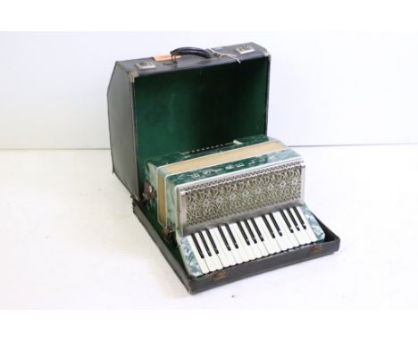 Italian Estrella twenty-four button piano accordion, cased, with two music books 