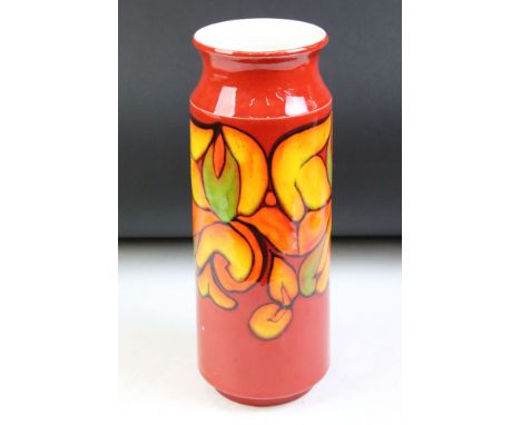 1970s Poole pottery Delphis pattern vase having a red ground with floral detailing. Impressed marks to the base, signed with 