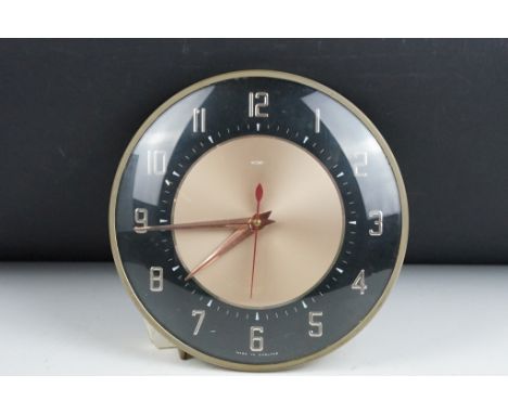 1960's Metamec electric wall clock, with chrome effect Arabic numerals on a black ground chapter ring, approx 20.5cm diameter