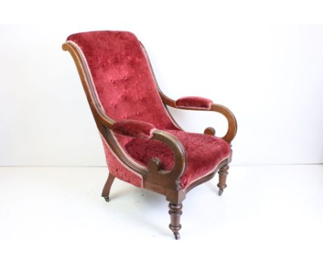 19th century Walnut Framed Scroll Arm Chair with button back red upholstery, raised on turned supports with castors, 70cm wid