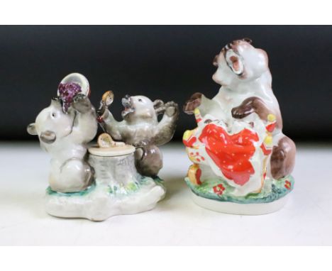 Two Russian Lomonosov ceramic bear figurine groups to include an inkwell in the form of two bears eating porridge and a figur