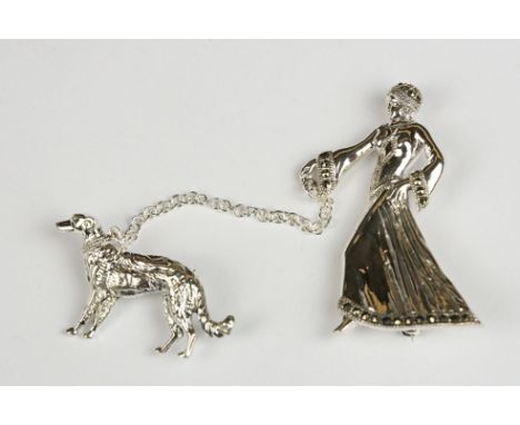 Silver Brooch in the form of an Art Deco style Lady walking a Dog 