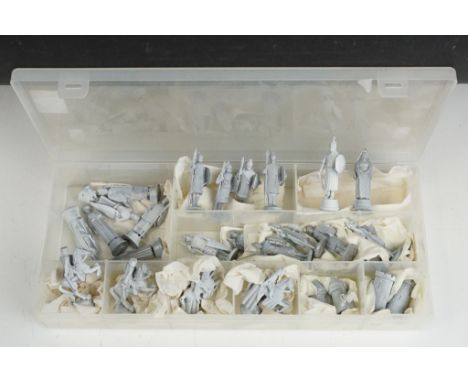 A lead chess set, unpainted, in the form of medieval characters. 