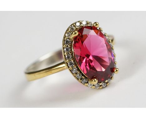 Silver Gilt Dress Ring with large faux ruby surrounded by CZs 