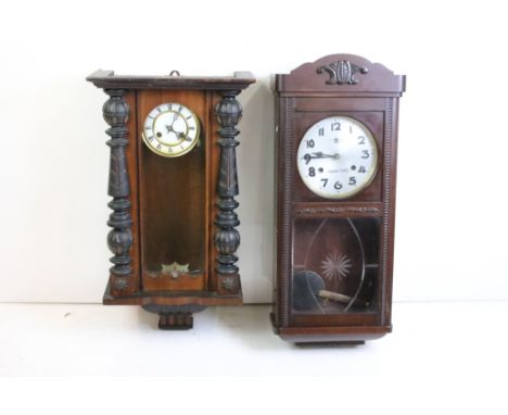 Two 20th Century wall clocks to include a Vienna regulator wall clock, and a later similar example by Kusama Tokei. Both miss