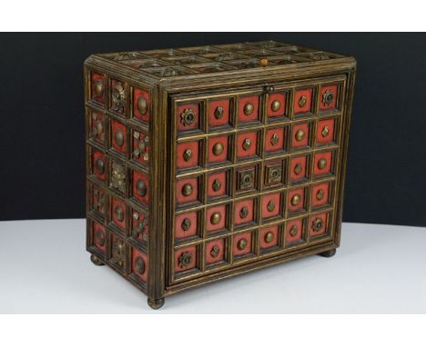 Late 19th / early 20th century gilt &amp; painted wooden box with drop front, carved floral motif &amp; stud decoration, the 