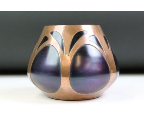 Early 20th Century Art Nouveau Loetz style glass vase having a purple iridescent glass body with pierced copper casing to the