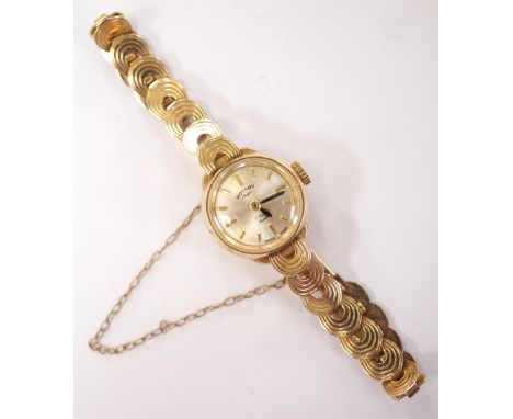LADIES ROTARY NINE CARAT GOLD CASED WRISTWATCHon nine carat gold link bracelet strap with safety chain, the champagne dial wi