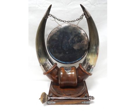 DECORATIVE VINTAGE TABLE DINNER GONGmodelled with a pair of plate mounted horns holding the gong, raised on a turned and shap