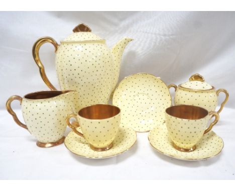 CARLTON WARE RITA STYLE COFFEE SETwith a lemon yellow ground with a green polka dots and a gilt interior, comprising six coff