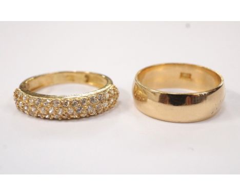 TWO EGYPTIAN GOLD RINGSone stone set and the other a wedding band, both ring size J