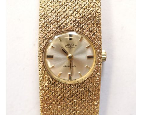 LADIES ROTARY NINE CARAT GOLD CASED WRISTWATCHon nine carat gold textured bracelet strap, the champagne dial with baton five 
