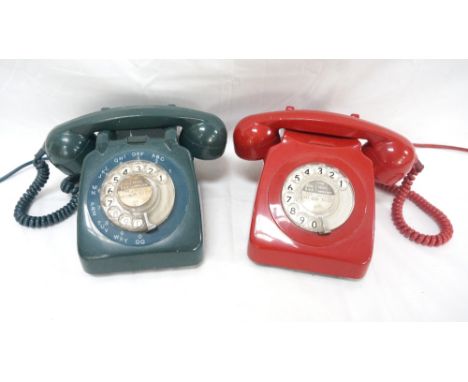 TWO RETRO TELEPHONESwith plastic bodies, one in bright red, the other in bottle green, both with rotary action dials 
