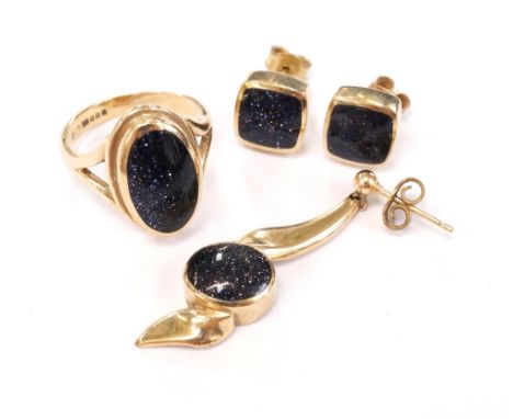 BLUE GOLDSTONE SET JEWELLERYall in nine carat gold, comprising a ring, size K; a pair of stud earrings; and a single drop ear